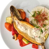 Seabass stuffed with seafood with steamed rice